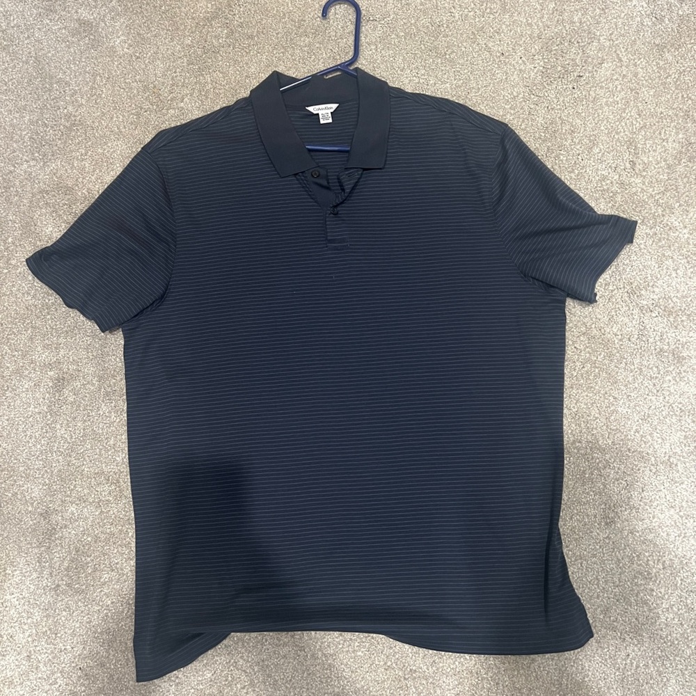 Calvin Klein shirt sleeve polo shirt. Size XL. Dark gray/black color.